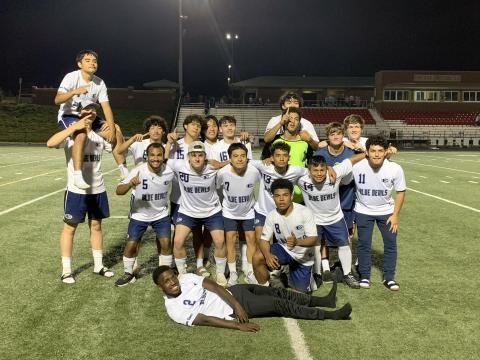 The Devils Soccer team celebrates after beating Social Circle 5-2 on the road in the first round of the GHSA State Playoffs. The win marked the second-ever playoff win in the soccer  team’s history. (Photo courtesy of Elbert County True Blue)