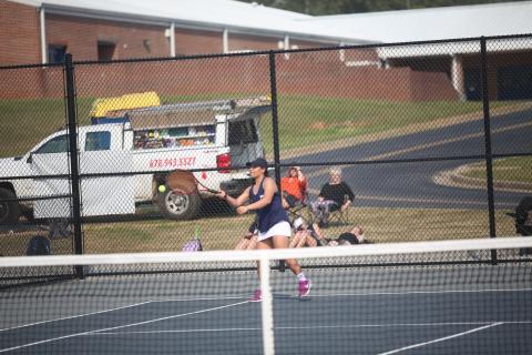 Lady Devil senior Katie Nguyen returns a serve during a March 21 match against Hart County. The Devil and Lady Devil seniors were recognized prior to the start of this year’s region tournament. (File photo by Wells)