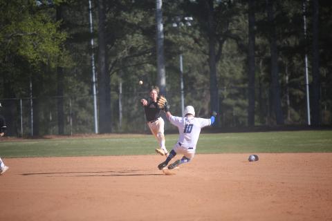 Brayden Ingram finishes off the second-half of a double play by throwing over to first after making a leaping catch to field the ball and tag second base for the first out. (Photo by Wells)