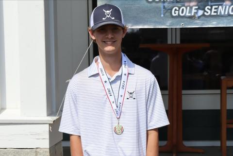 Devil golfer Landon Cagle poses with his first-place medal after finishing with the lowest individual score and being named low medalist of the Area 1A Division 1 championship match. (Photo courtesy of Larry Kesler)