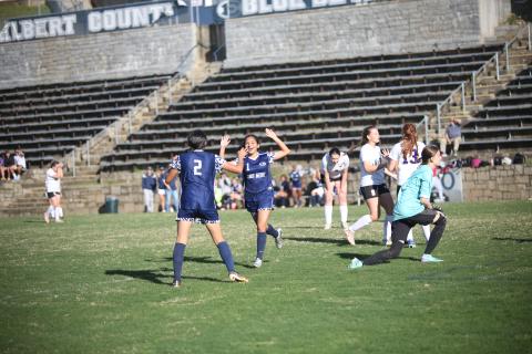 No. 1 Vivian Salazar celebrates with No. 2 Allison Medina after scoring a goal during Elbert’s win over Athens Christian. (Photo by Wells)