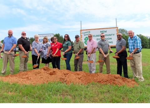 Getting their shovels moving during the ground-breaking cermony on May 24 are County Administrator Allen Hulme, Agriculture/Natural Resources Agent Brian Bradford, Family and Consumer Science Agent Christa Campbell, Administrative Assistant Trisha Willis, Office Assistant Homerzell Heard, Program Assistant Sophie Walsky, 4-H Agent Lauren Dye, Commissioner Chris Alexander, Commissioner Casey Freeman, Commission Chairman Lee Vaughn, Commissioner Freddie Jones and Commissioner David Hunt. (Photo by Weeks)