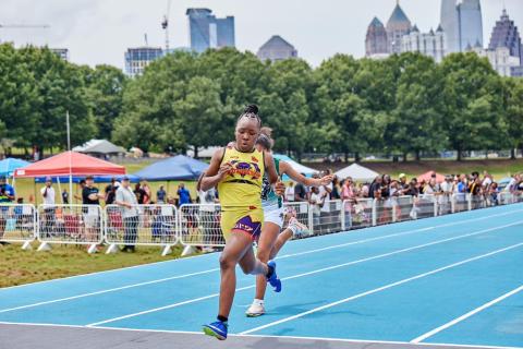 Makenzie Cade beats another runner to the finish line at the ATL City Games. (Photo submitted by Joshua Bolton)