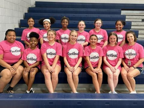 The ECMS football cheerleading squad includes (front row, L-R) Coach Dishae Blackwell, Myla Hood, Matylee Brown, Liberty Rousey, Presley Bellew, Sequoia Singleton and Coach Jamie Keblish and (back row, L-R) Jolee Ainsworth, Surrender Goings, Kenjia Davis, Piper New, Claire Moon, and Charity Oglesby. (Photo submitted by Jamie Keblish