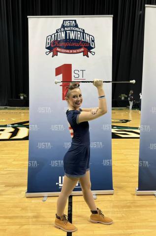 Lyndsie Acker poses after finishing first in both the national championship and world qualifier at the U.S. National Baton Twirling Championships in Fairborn, Ohio July 14. (Photo courtesy of Eden Acker)