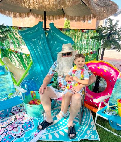 Dakota Johnson "chilled out" with Santa at Main Street's 2023 Christmas in July event on the public square.