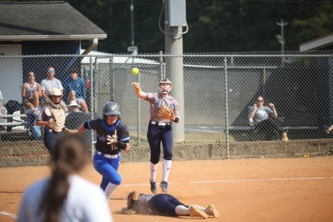 Audrey Lunsford leaps and throws over Ky Dubose during the 2023 season. Lunsford, Dubose and the Lady Devils softball team are scheduled to start their 2024 season with an away game against North Oconee Aug. 1. (File photo by Wells)
