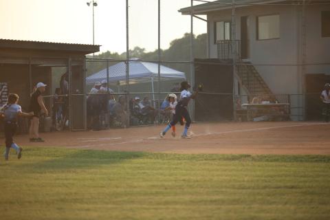 Sameria McClendon catches the ball while tagging first base to put out a runner during the 8-10-year-old Softball District 7 Championship Game against Hart June 27.  (Photo by Wells)