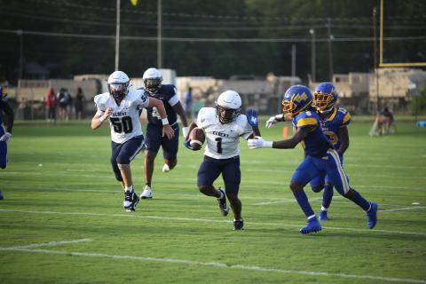 No. 1 Ty’Rikis Jones throws out a stiff arm during a long reception in the Aug. 2 scrimmage against Washington-Wilkes. (Photo by Wells)