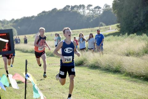 Dakota Toole crosses the finish line in third place overall during the Bill Woods Pridelands High School Invitational Sept. 7. (Photo by Shane Scoggins - Franklin County Citizen)