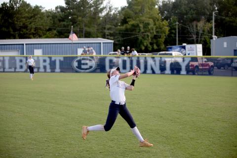 Hannah Brady makes a leaping catch in the outfield. (Photo by Wells)