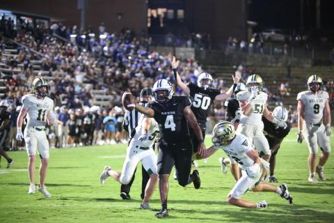 No. 4 Jayvyn Hickman extends the ball over the goal line for an Elbert touchdown late in the fourth quarter while No. 50 Landon Williams celebrates. (Photo by Wells)