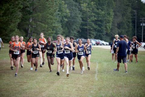 The female runners kick off the first-ever Granite City Invitational varsity girls race at Camp Harmony Sept. 24. The Lady Devils finished with a pair of runners on the podium while the Devils finished second overall. (Photo by Wells)