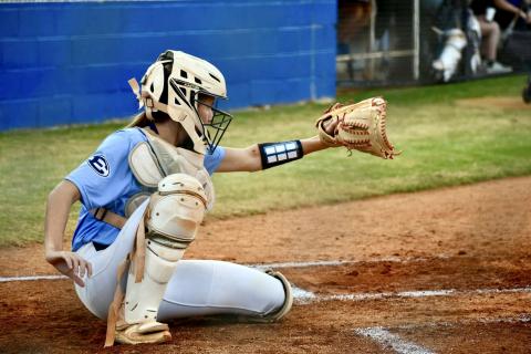 Lady Devil catcher Reagan Baker frames a pitch in Elbert County’s series against Bremen Oct. 24. (Photo by Bethany Booth - Elbert County True Blue)