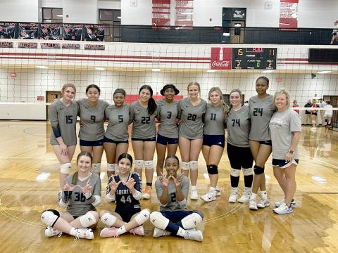 The Lady Devils volleyball team poses after getting their first win over Rabun County in program history Oct. 8. The win came in the first round of the Area 8A tournament and was also Elbert’s first win in the area tournament. (Photo courtesy of Anya Human)