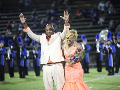 Rob Robinson and daughter Heaven Robinson celebrate upon hearing Heaven's name being called as the 2024 ECCHS Homecoming queen. (Photo by Wells)