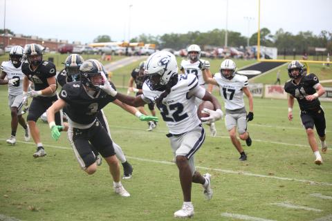 Jacari Barnett stiff arms a Commerce defender during Elbert County’s 42-27 loss to Commerce Sept. 28. Barnett led the team in rushing yards after gaining 130 yards on 20 carries. (Photo by Wells)