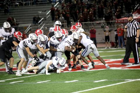 No. 4 Jayvyn Hickman gets a push from No. 13 Brady Dickerson, No. 50 Landon Williams, No. 64 Camron Ardister, No. 26 Colson Brown and No. 8 Marion Rambert to convert on fourth down during Elbert County’s win over Rabun County Nov. 1.  (Photo by Bethany Booth - Elbert County True Blue)