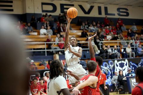 Jordon Morrison rises and attempts a floater during Elbert’s loss to Madison County Dec. 7. (Photo by Wells)