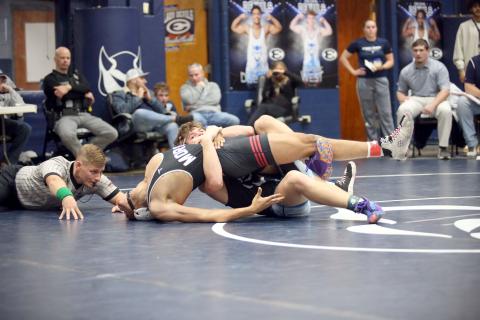 Brycin Hughes tries to get his opponents shoulders flat on the ground as he looks for a pin during the Granite City Duals hosted by Elbert County in the Inferno Dec. 21. Hughes later finished off the pin and finished 3-2 overall on the day. (Photo by Wells)