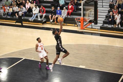 A.J. Brown soars through the air to punctuate a fast-break chance with a slam dunk during Elbert’s loss to Hart County Dec. 28. (Photo by Wells)