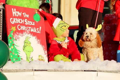 Dakota Johnson and "Max" represent "How the Grinch Stole Christmas," one of many "stories" featured on Dewy Rose Baptist Church's first place  parade entry in the annual Elberton Christmas parade held Dec. 8. (Photo by Weeks)