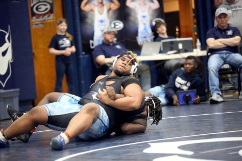 Senior M.J. Cook maneuvers around his opponent while fighting for leverage during the Inferno Invitational hosted by the Mat Devils in the Inferno Jan. 25. (Photo by Wells)