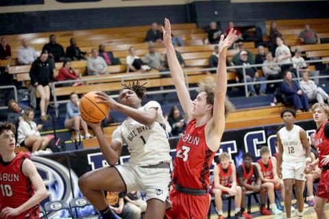 Dealyn Gray drives in from the wing and elevates to put the ball past a Rabun defender. (Photo by Wells)