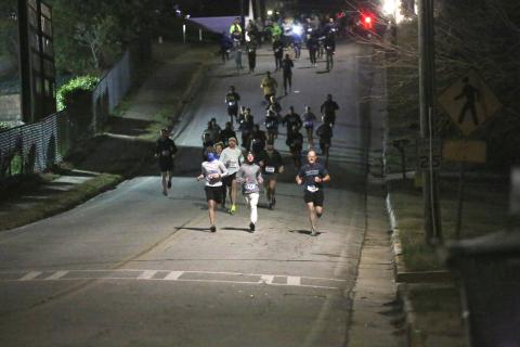 Over 100 participants of the 21st annual Twilight Stroll hosted by the Elbert County Chamber of Commerce travel the first leg of the 3.1 mile race in downtown Elberton on Friday, Jan. 3. (Photo by Wells)