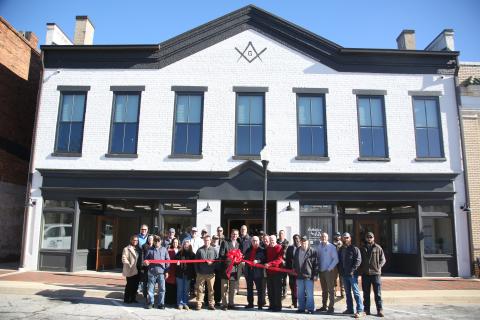 City council members, Main Street representatives, representatives from the office of John Ossof and local citizens cut the ribbon at the remodeled Bailey Building which will be home to two retail shops and two apartments upstairs. 