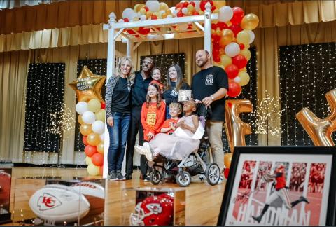 During the Feb. 22 pageant, FHF awarded the Family of the Year award to the Moon family. Pictured are (L-R)FHF president Sandy Adams,  Mecole Hardman, Olivia Moon, Avery Moon (held by Abby Moon), Andrew Moon, Miss Little FHF Priya Moon, and Brent Moon.