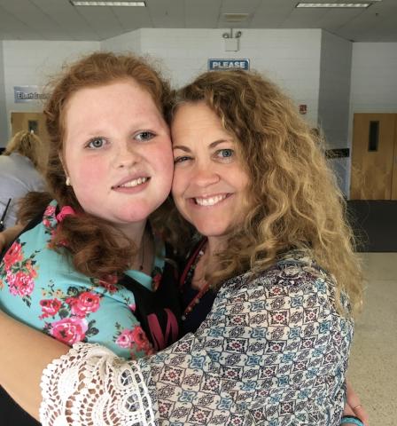 Marti Love Terrell and her long-time teacher Chrystal Thomas share an embrace during Marti's last days at ECMS.