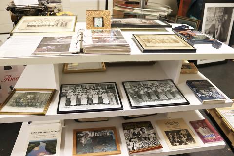 A display of photographs decorate the interior of the Jim-Ree Museum.