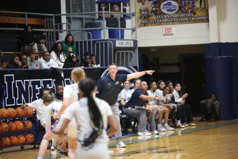 Head Coach Josh Jones (left) and Assistant Coach Sonee Bennett (right) direct traffic on the court during an Elbert game in the Inferno. 