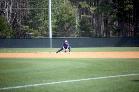 Rylan Brown fields a ground ball before throwing over to first base for an out in the first game of Elbert’s doubleheader on the road against Athens Academy. (Photo by Wells)