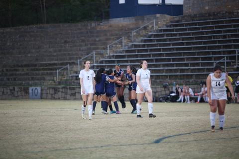 The Lady Devils swarm Victoria Medellin after she scored the game-winning goal in the second-half of extra time to beat Commerce 3-2 March 14. (Photo by Wells)