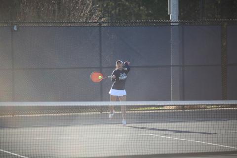 Emily Poon returns a serve during her win in the No. 1 singles match against Washington-Wilkes March 6. (Photo by Wells)