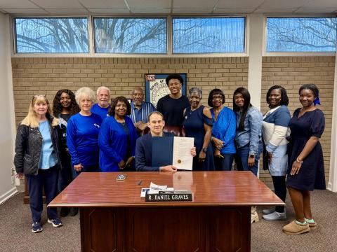 On hand for the signing of the proclamation for Colon Cancer Awareness Month are (L-R) Susie Payne, Sherell Eberhardt, Ellen and Merrill Franklin, Edna Eberhardt, Bobby G. Hunt, Mayor Daniel Graves, Travis Allen, Pam Allen, Margie Hunter, Anissa McIntosh, Kirsten Porter and Jurnee Porter. (Photo submitted by Devan Seawright)