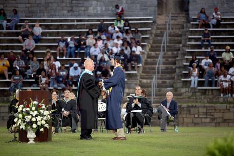 Brady Dickerson receives the Faculty Cup from ECCHS Principal Josh Rider. (Photo by Wells)