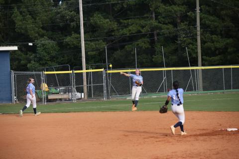 Audrey Lunsford rockets the ball towards home plate during Elbert’s win over Lincoln County Aug. 14. (Photo by Bo Underwood)