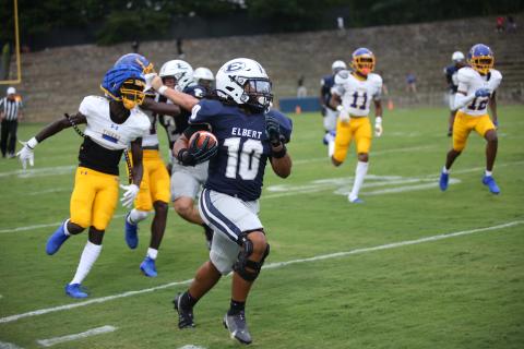 Running back D.J. Fortson carries the ball in a scrimmage between Elbert County and Washington-Wilkes on August 1. (Photo by Bo Underwood)