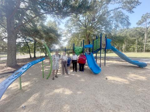Mayor Scott Harpold, John Beucler, Lera Ray, council member Henrietta Maxwell and city clerk Tiffany Verdell pose at the ribbon cutting for Bowman's new playground. (Photo by Mark Wells)