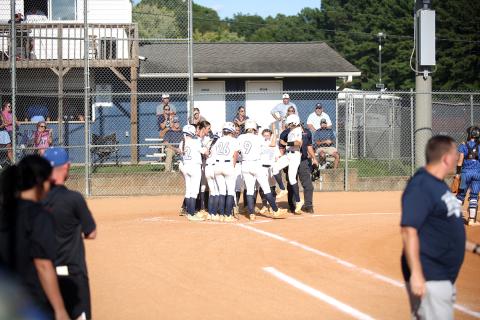 Teammates celebrate with  junior catcher Ky Dubose after a 3-run home run against Banks County. (Photo by Bo Underwood)