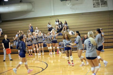 Trania Skelton (2) and Alexia Vargas (far right) celebrate after a point in Elbert’s match against Rabun County on September 3. (Photo by Bo Underwood)