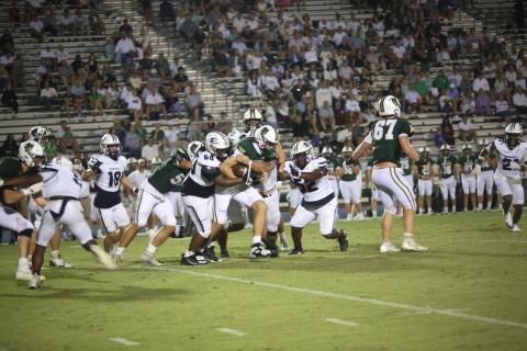 A host of Devils wrap up a Wesleyan ballcarrier during Elbert’s 14-7 loss Aug. 29. (Photo by Bo Underwood)