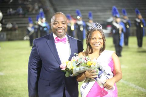 Jaslyn Huff (right) sports her homecoming queen crown alongside her father Jasper Huff (left) . (Photo by Bo Underwood)