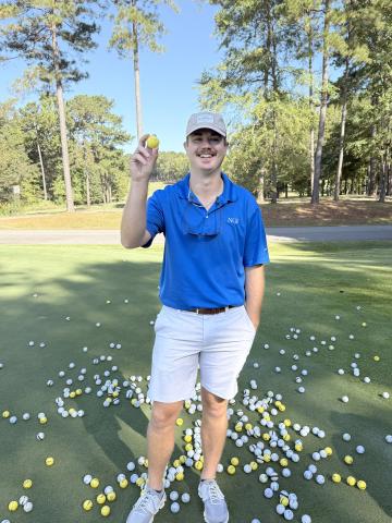 Tournament volunteer Colton Moon pulled Jason Floyd's golf ball during the annual golf ball drop, making Floyd the winner of the $500 grand prize.  