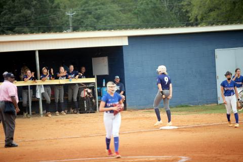 Audrey Lunsford (9) celebrates a triple against Oglethorpe. (Photo by Bo Underwood)
