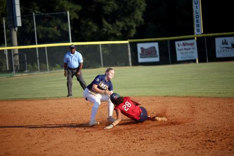 Audrey Lunsford (left) attempts to tag a runner out at second base. (Photo by Bo Underwood)
