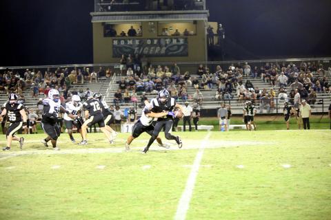 Kaden Montgomery (17) forces a fumble to seal Elbert’s 16-6 road victory over Commerce on Sept. 26. (Photo by Bo Underwood)